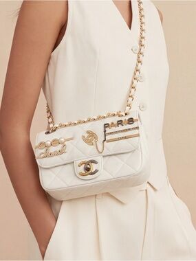 CHANEL White Quilted Crossbody Bag with Gold Hardware and Paris Accents
